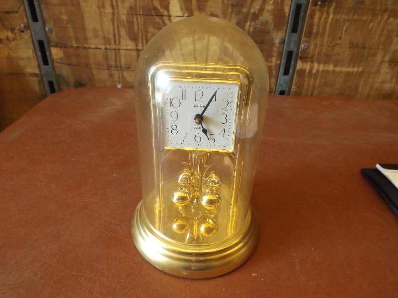 Sunbeam under globe clock.&nbsp Wo...