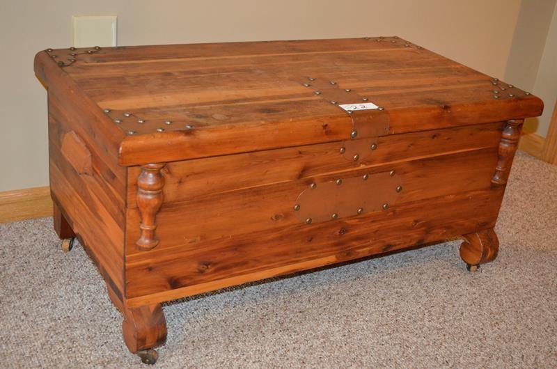 lot 22 image: Vintage Cedar chest on wheels with ...