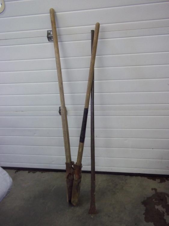 Post hole digger with tamping bar...