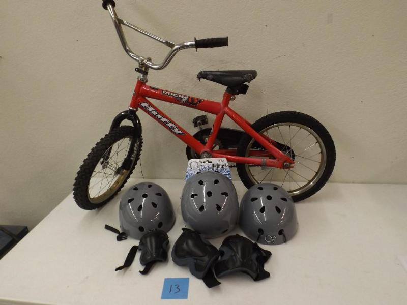 Huffy kids bike with 3 OP helmets a...