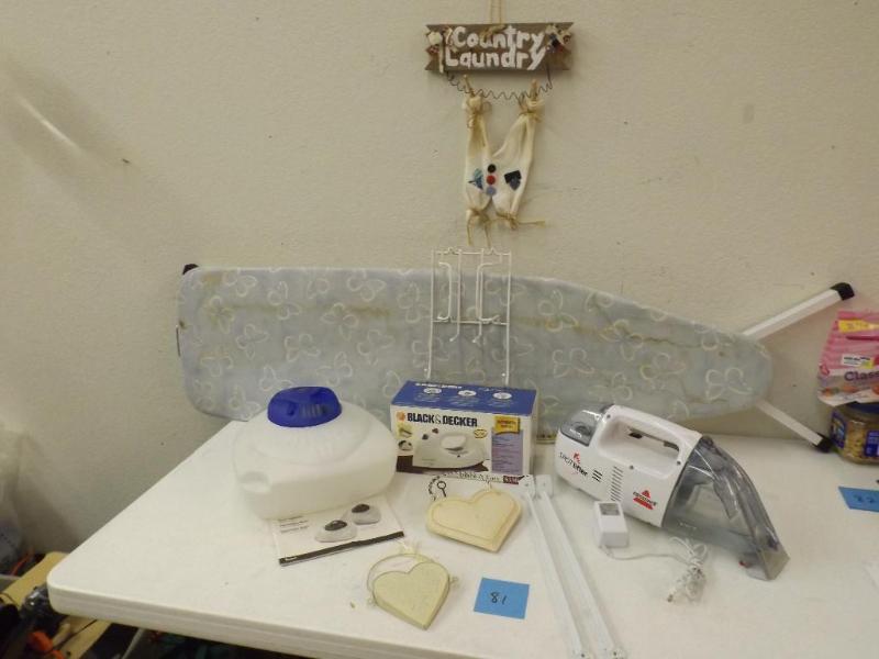 Country laundry, Iron with board an...