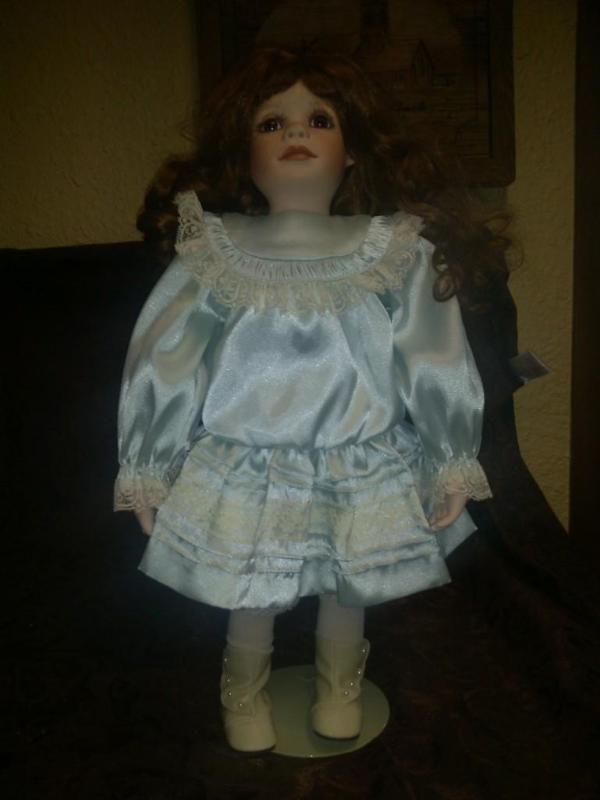 Collectable Porcelain Doll with blu...