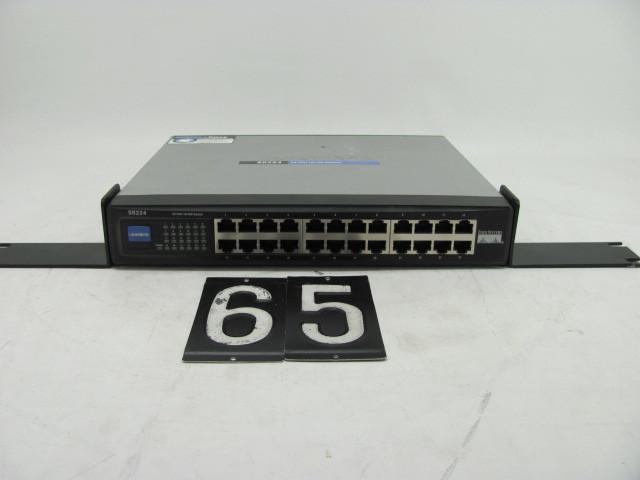 lot 65 image: Cisco SR224 network switch. Tested ...