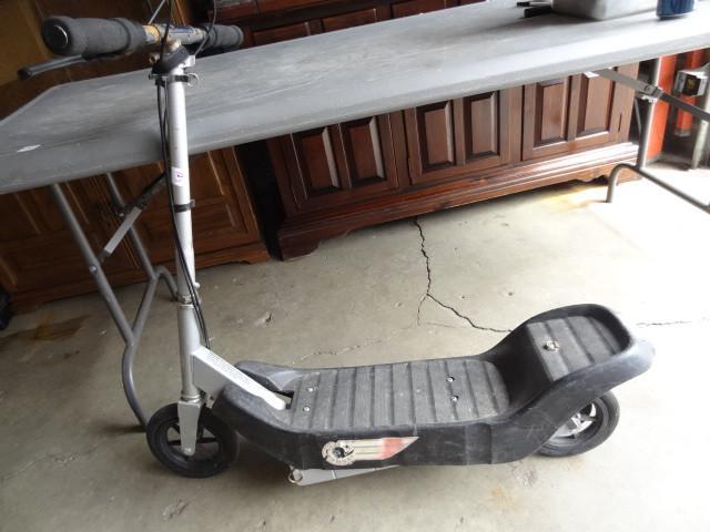lot 123 image: Silver bomber electric scooter. No ...
