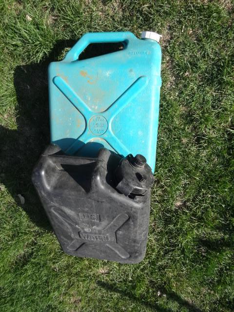 lot 16 image: 5 and 6 gal water jugs...
