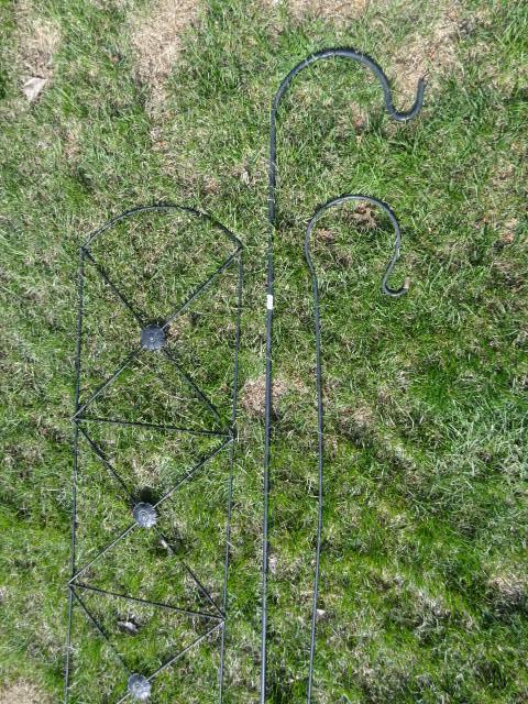 lot 22 image: 2 metal shepards hooks. Metal trell...