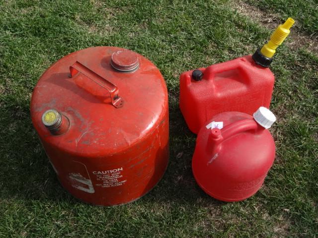 lot 36 image: 5 gal metal gas can and 2 plastic g...