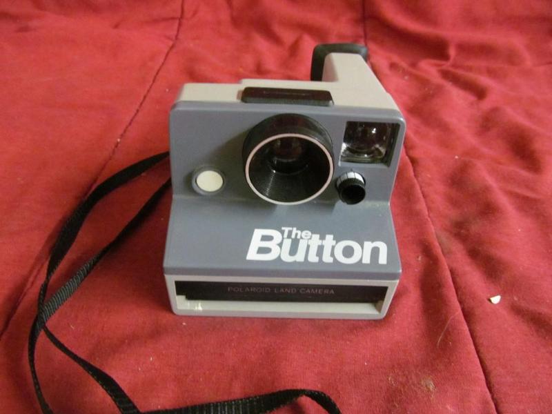 lot 119 image: Button Polaroid Land Camera...