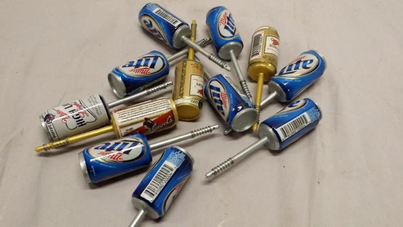 12Fishing bobbers of different beer...