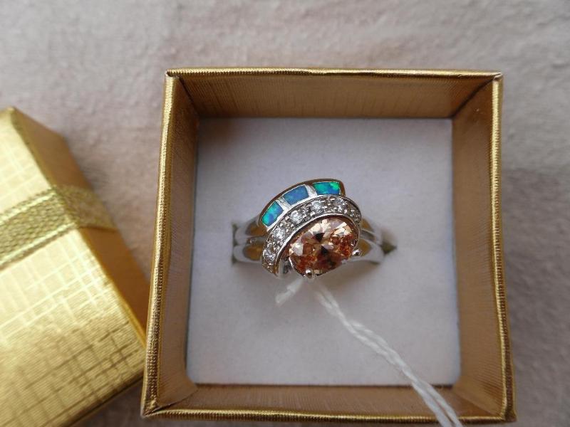 lot 126 image: Shining silver ring with amber colo...