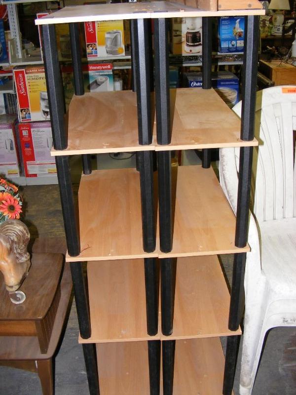 lot 557 image: 2 book shelves. They have screw hol...