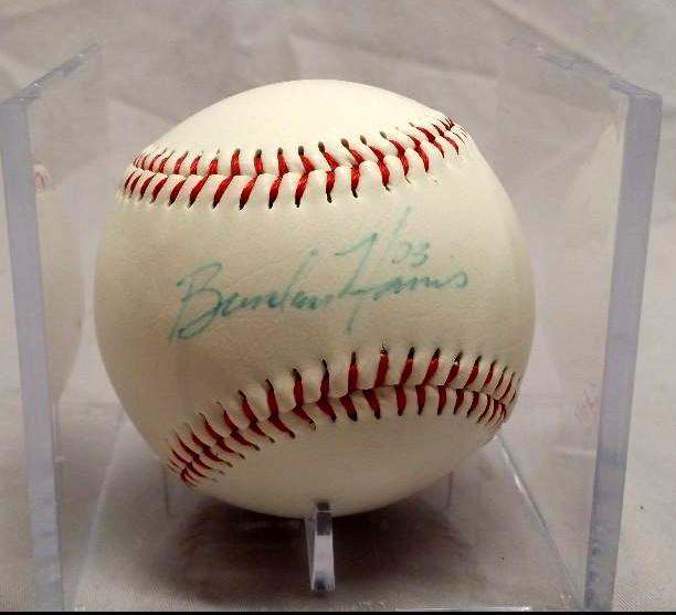 lot 49 image: Signed Brendan Harris baseball in a...