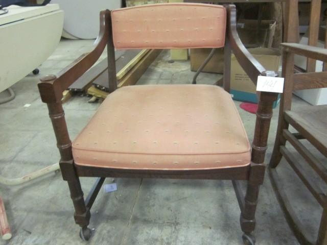 Vintage wooden chair on rollers. &n...