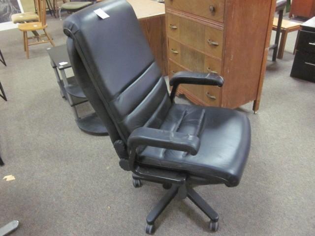 Black office chair, with some damag...