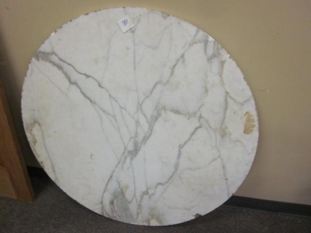 42 in. round marble slab with some ...