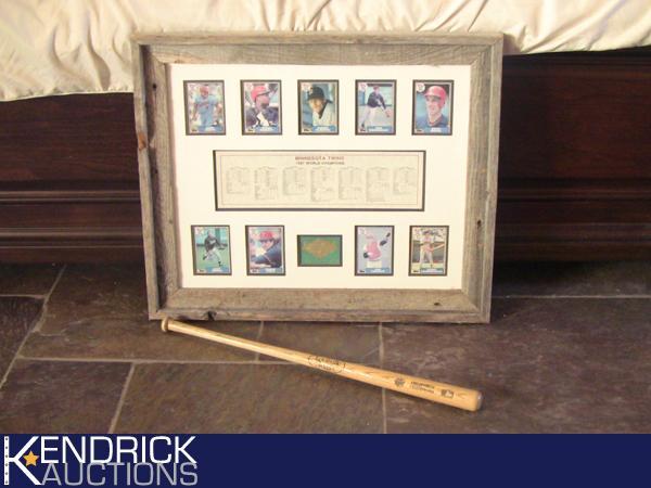 lot 30 image: Framed MN Twins 1987 World Champions Collage, with Collectible Mini Wood Louisville Slugger Bat