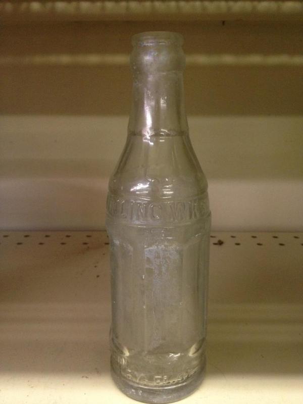 lot 61 image: Benson Bottling WKS 6 12 oz Glass Bottle