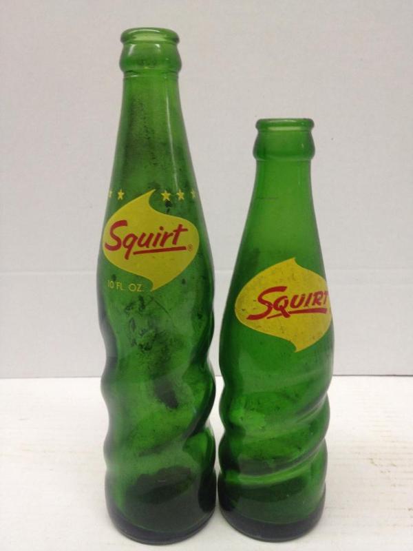 lot 64 image: 2 Vintage Green Squirt Bottles