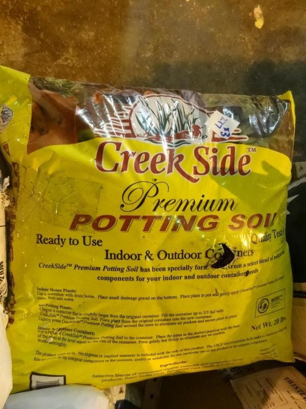 lot 277 image: Approx 60 lbs premium potting soil...