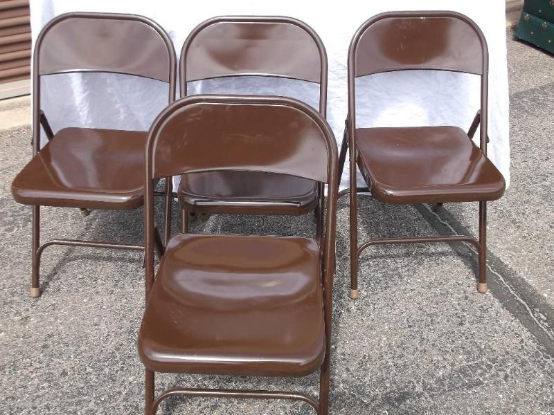 4 Metal folding chairs few minor sc...