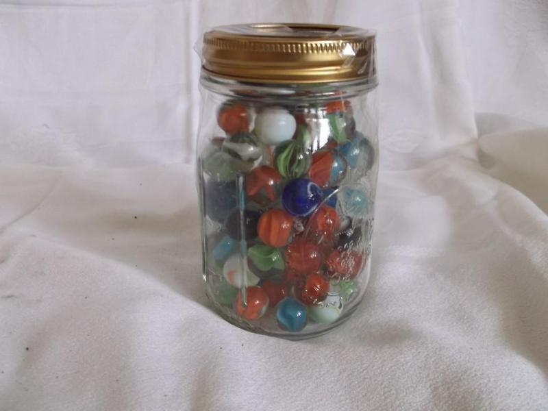 &nbspMedium size jar of marbles ha...