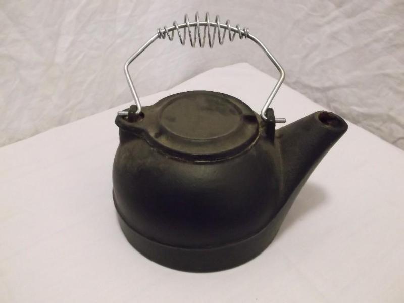 Heavy cast iron tea pot rusty on in...