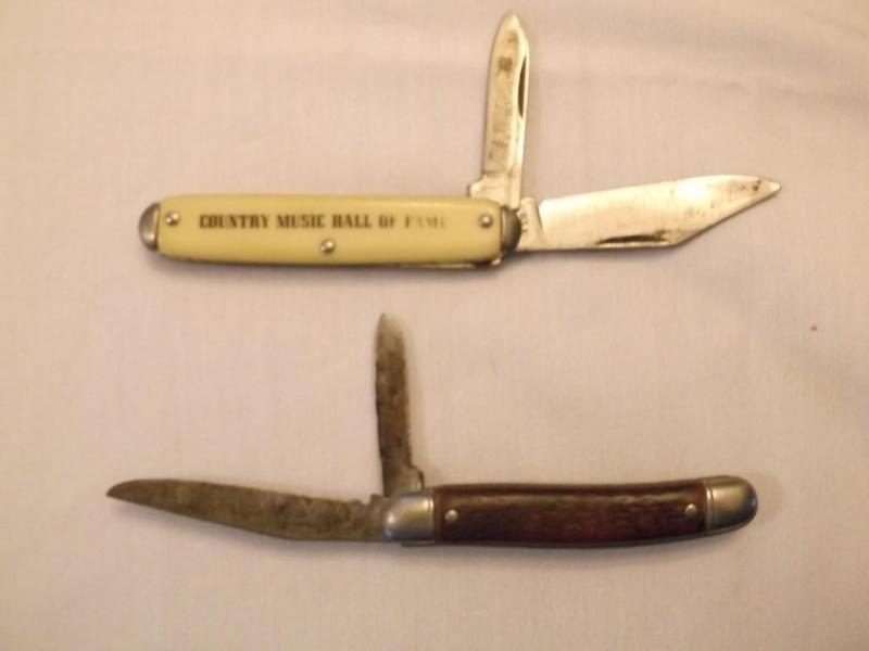 2 Folding pocket knifes one has Cou...