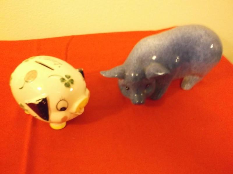 Two cute ceramic pigs one is a bank...