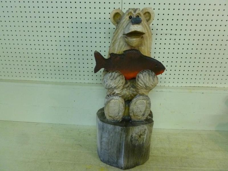 Beautiful wooden chainsaw art patio...