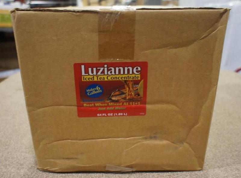 lot 61 image: Luzianne Iced Tea concentrate. 64 o...