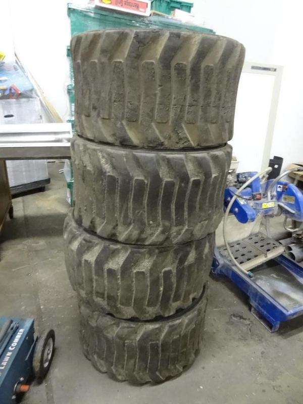lot 8 image: Set of 4 skid steer tires. 31 x 15....