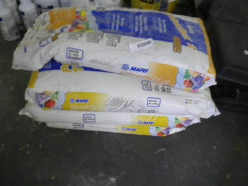 4 bags of white tile mortar...