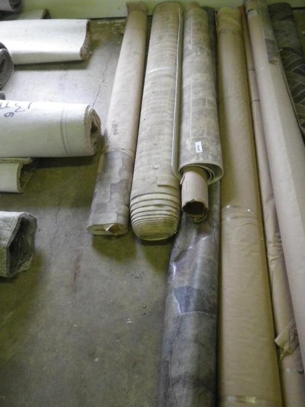 4 smaller rolls of linoleum...