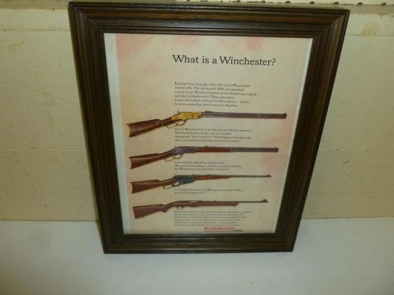 lot 63 image: Vintage Winchester wood framed adve...