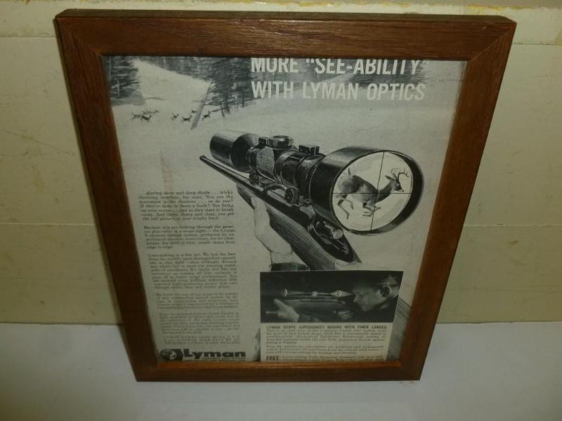 lot 67 image: Vintage Lyman Optics wood framed ad...