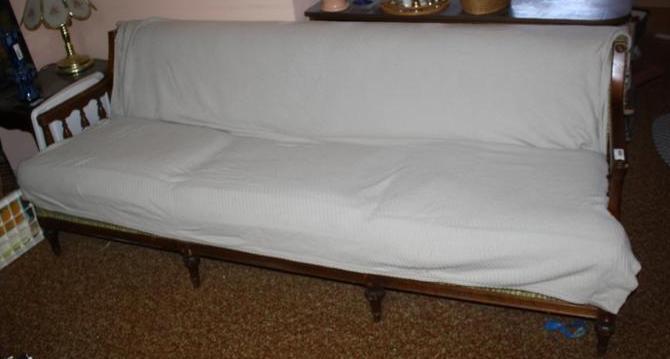lot 121 image: Couch and wood armrests - looks lik...