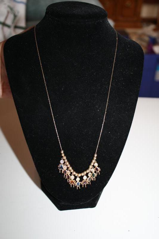 lot 264 image: 14 Karat Gold Necklace with charms....