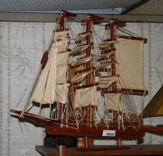 lot 80 image: Imported wood ship and sails on sta...