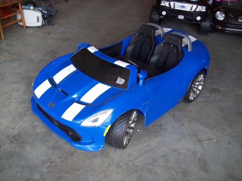 lot 1 image: Blue convertible -New -2 seater -12...