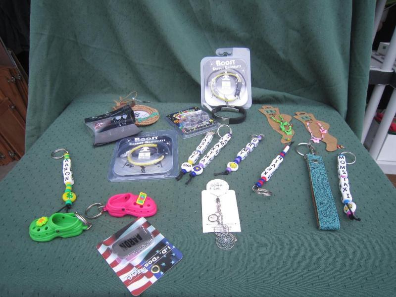 lot 146 image: Misc Energy Bracelets , Key Chains ...