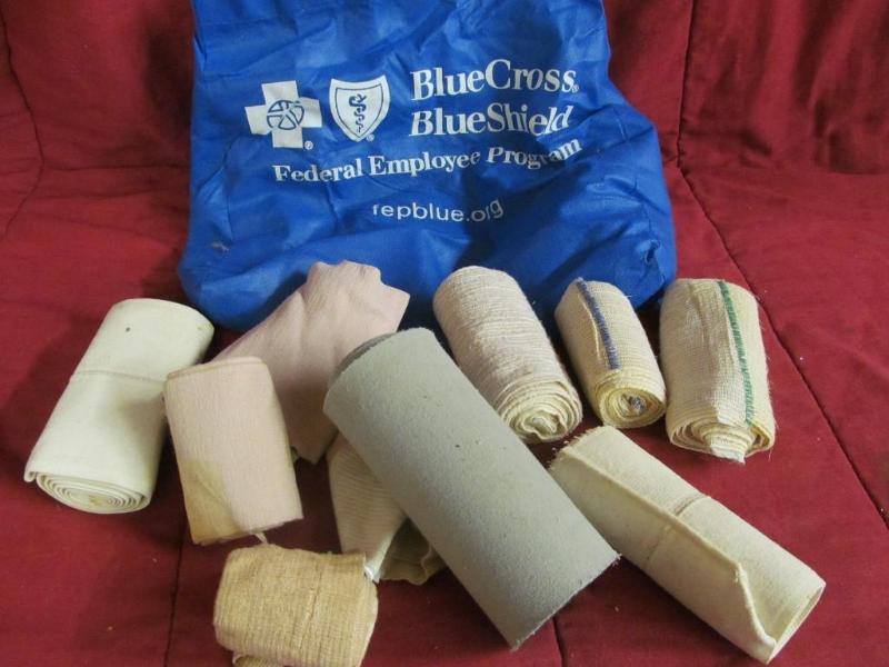 lot 173 image: Blue Cross Bag with Bandages and Wr...