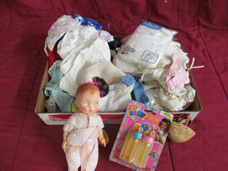 lot 91 image: Box of Doll Clothes and a Vintage d...
