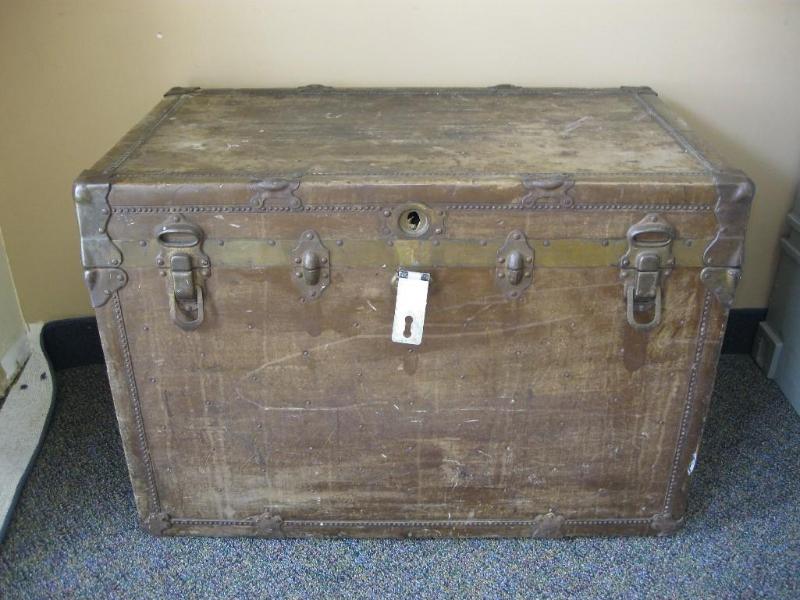 Vintage Trunk With Metal Wheels Has...