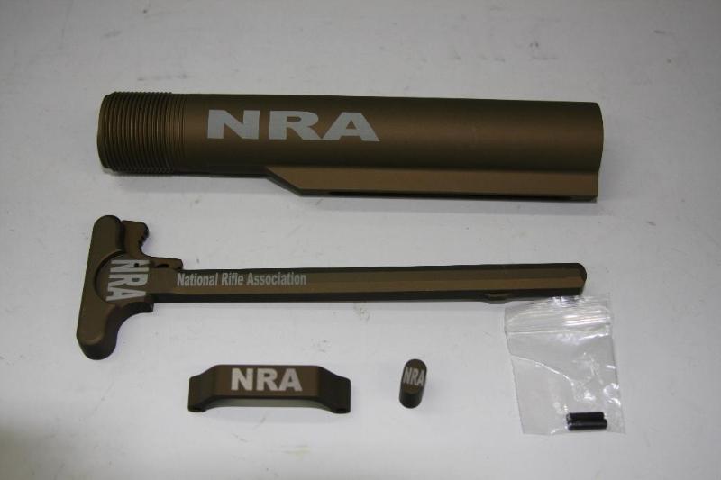 lot 42 image: NRA. Black laser etched AR accessor...