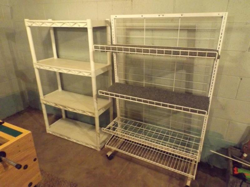 lot 34 image: Two shelving units, one has casters...