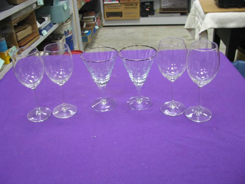 six clear wine glasses...
