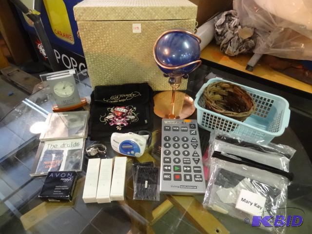 lot 108 image: Large universal remote. Mary Kay ma...