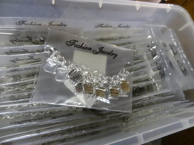 lot 135 image: Ten commandments bracelets. Qty 50....