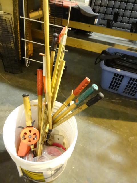 lot 179 image: Bucket of ice fishing poles...