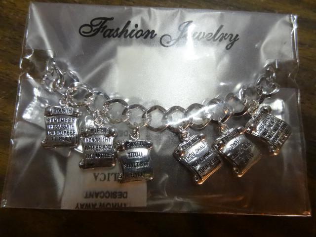lot 98 image: Ten commandments bracelets. Qty 50...